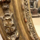 Large golden oval mirror