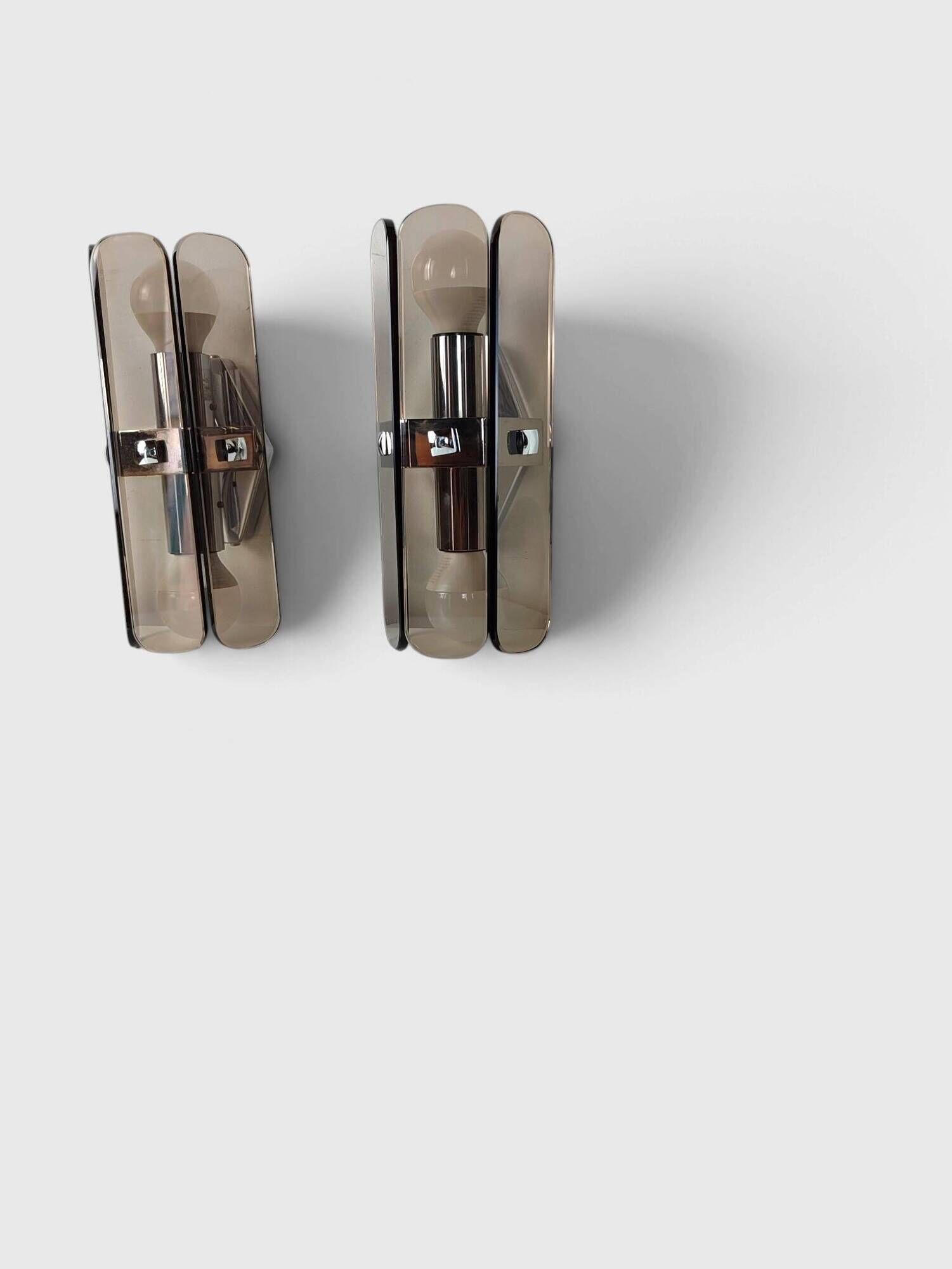 Pair of smoked glass and chrome wall lights attributed to Fontana Arte – Years