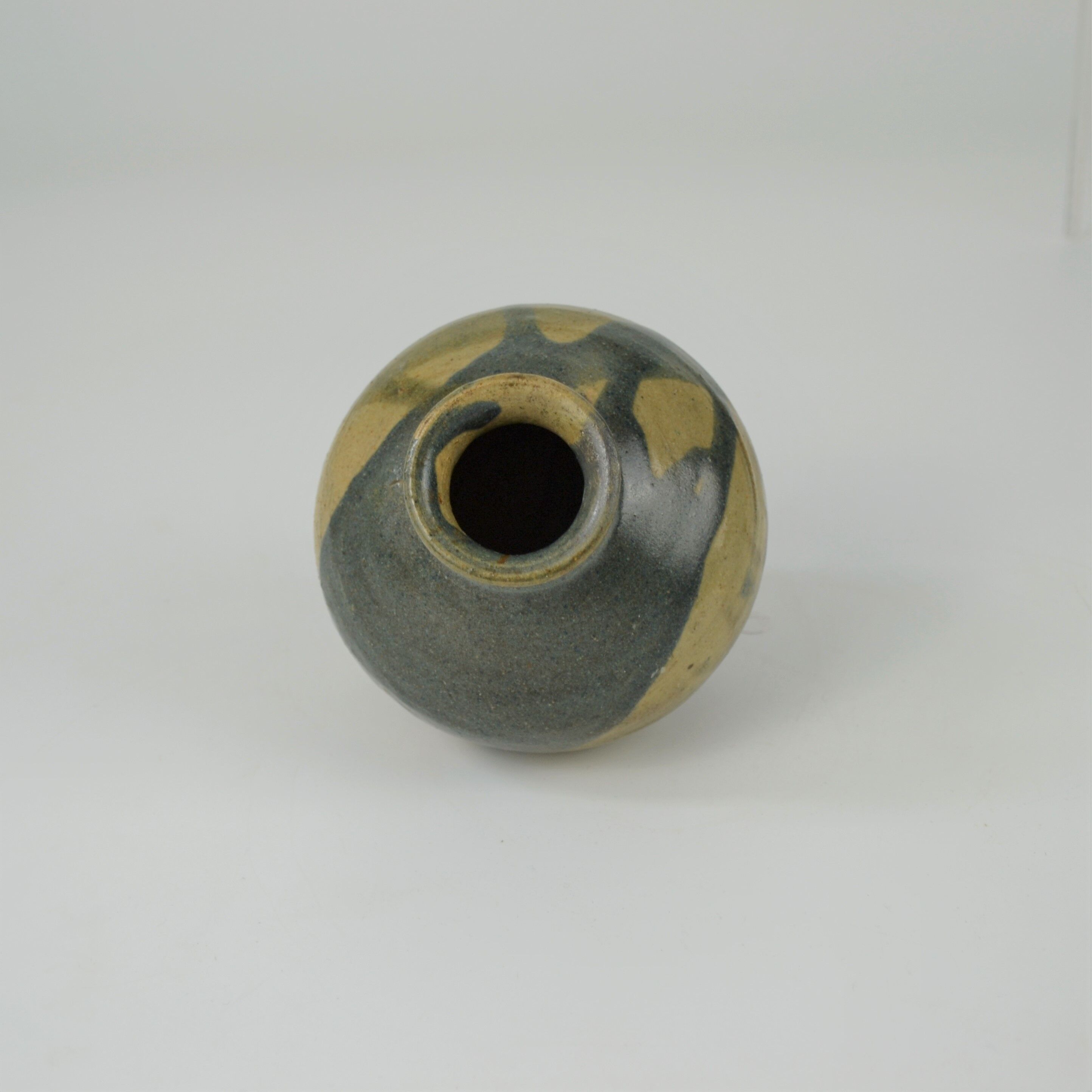 Sandstone ball vase by Eugène Lion