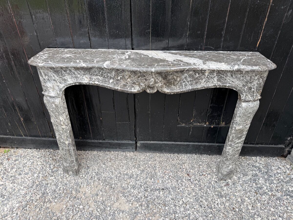 Louis XV fireplace in grey Saint Anne marble, 18th century.