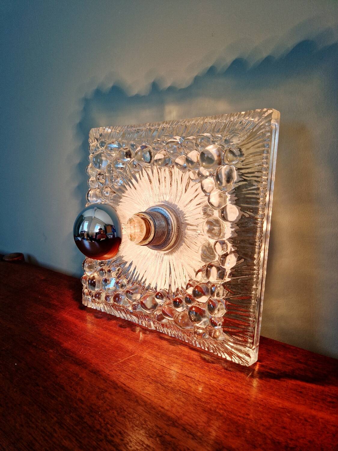Space Age wall light in pressed transparent moulded glass, 1970.