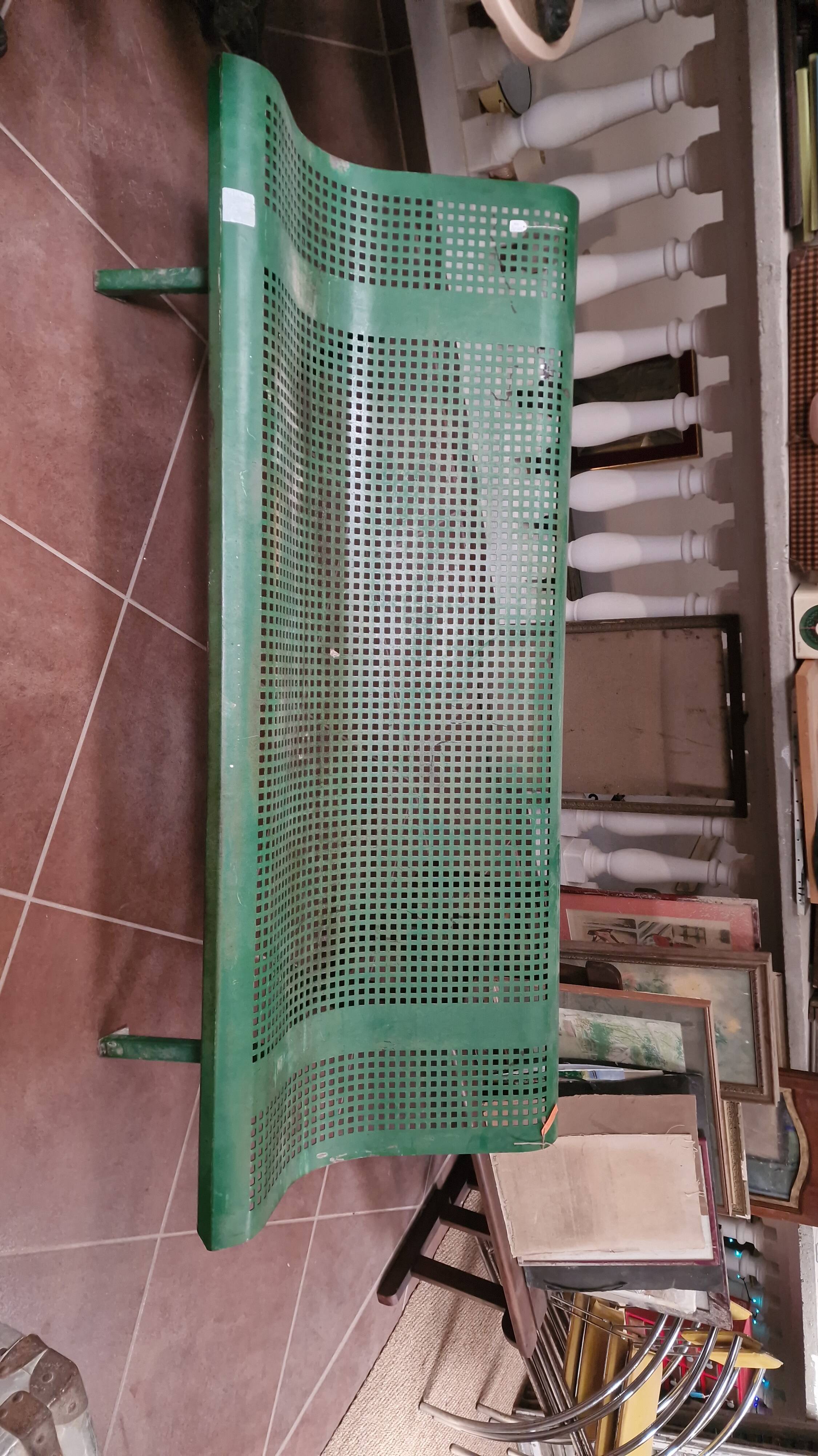 Vintage green perforated metal public bench