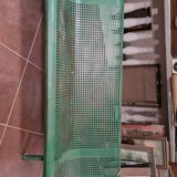 Vintage green perforated metal public bench