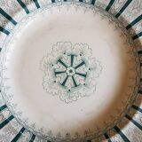 A plate made of earthenware decorated with flower crown