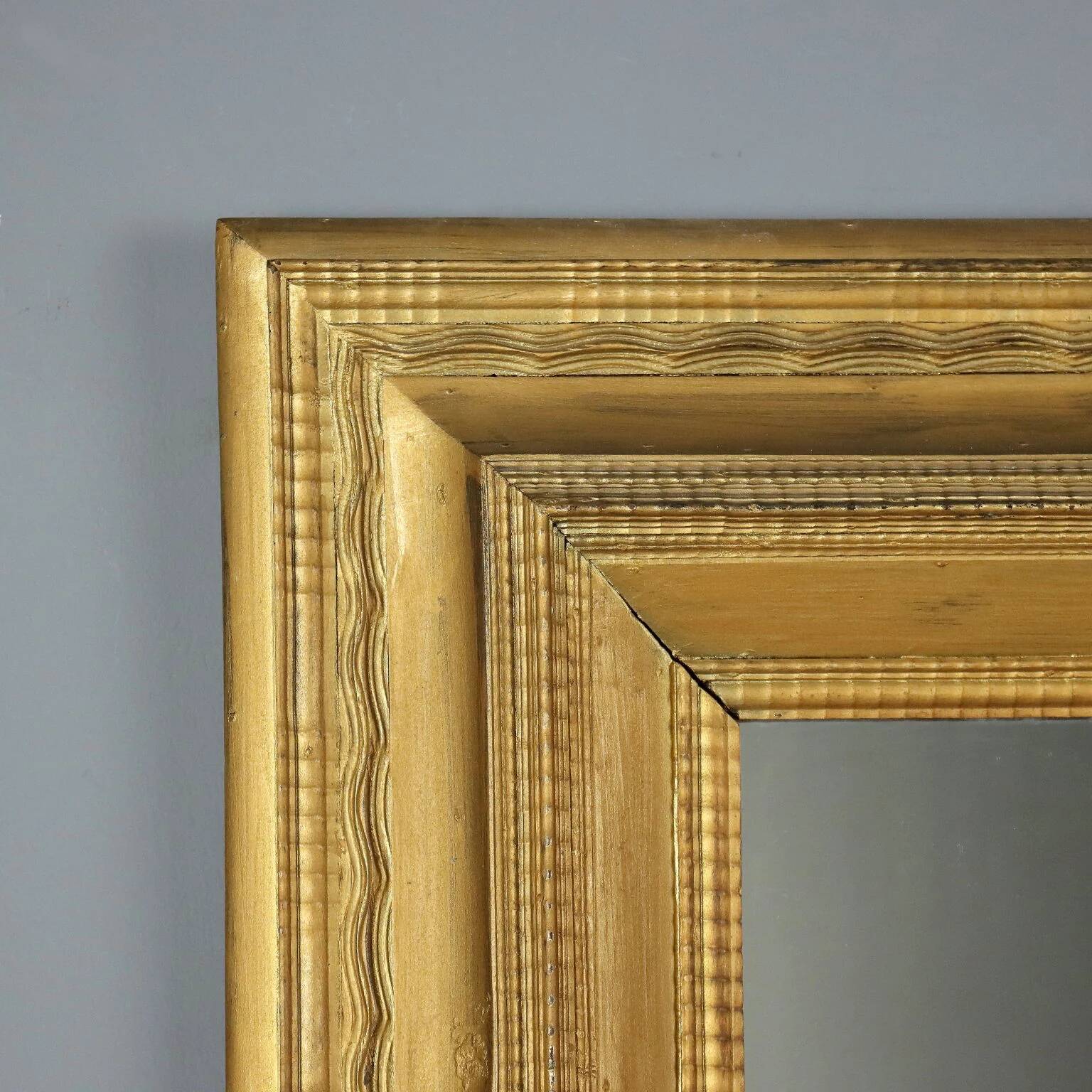 Antique gilded wooden mirror with guilloché frame, Italy, 19th century.