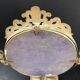Miroir en bronze pivotant