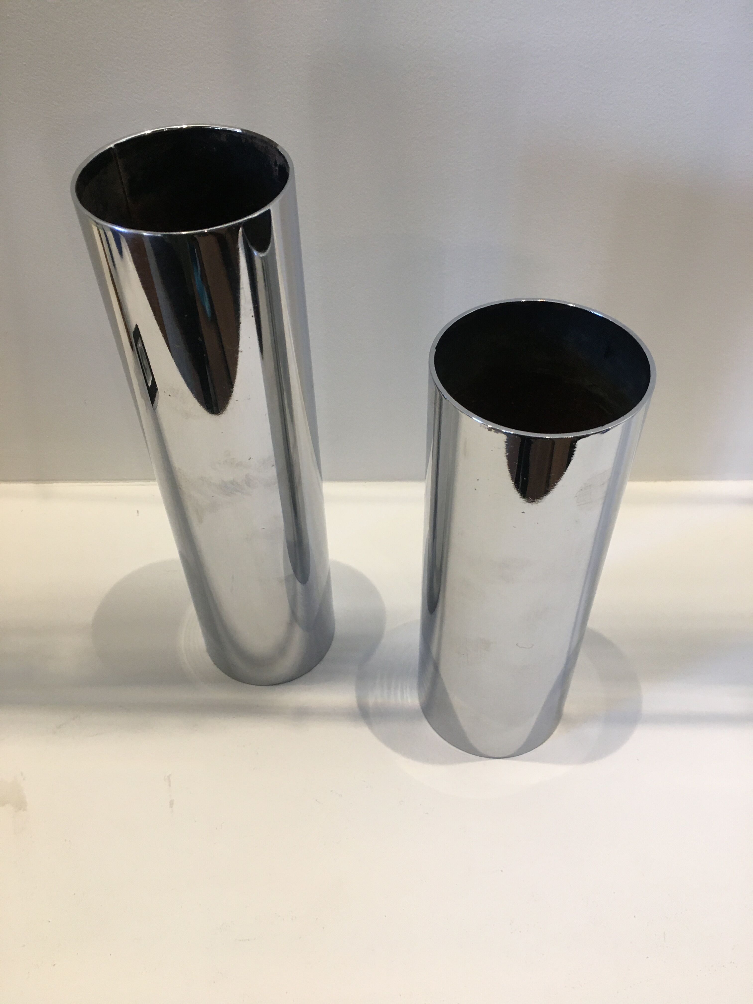 Pair of silver metal tube vases