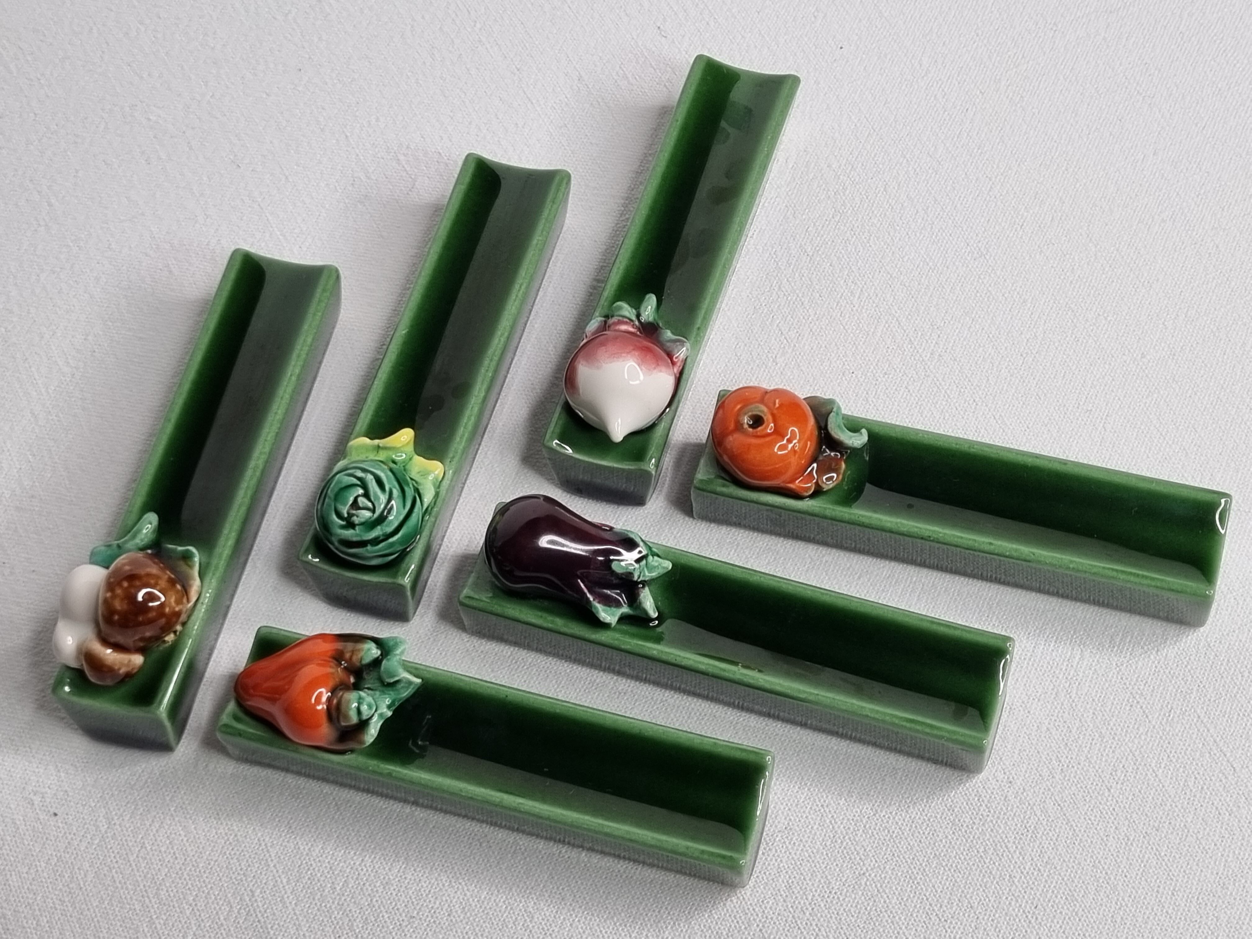Set of six enamelled ceramic knife holders decorated with vegetables from the sun