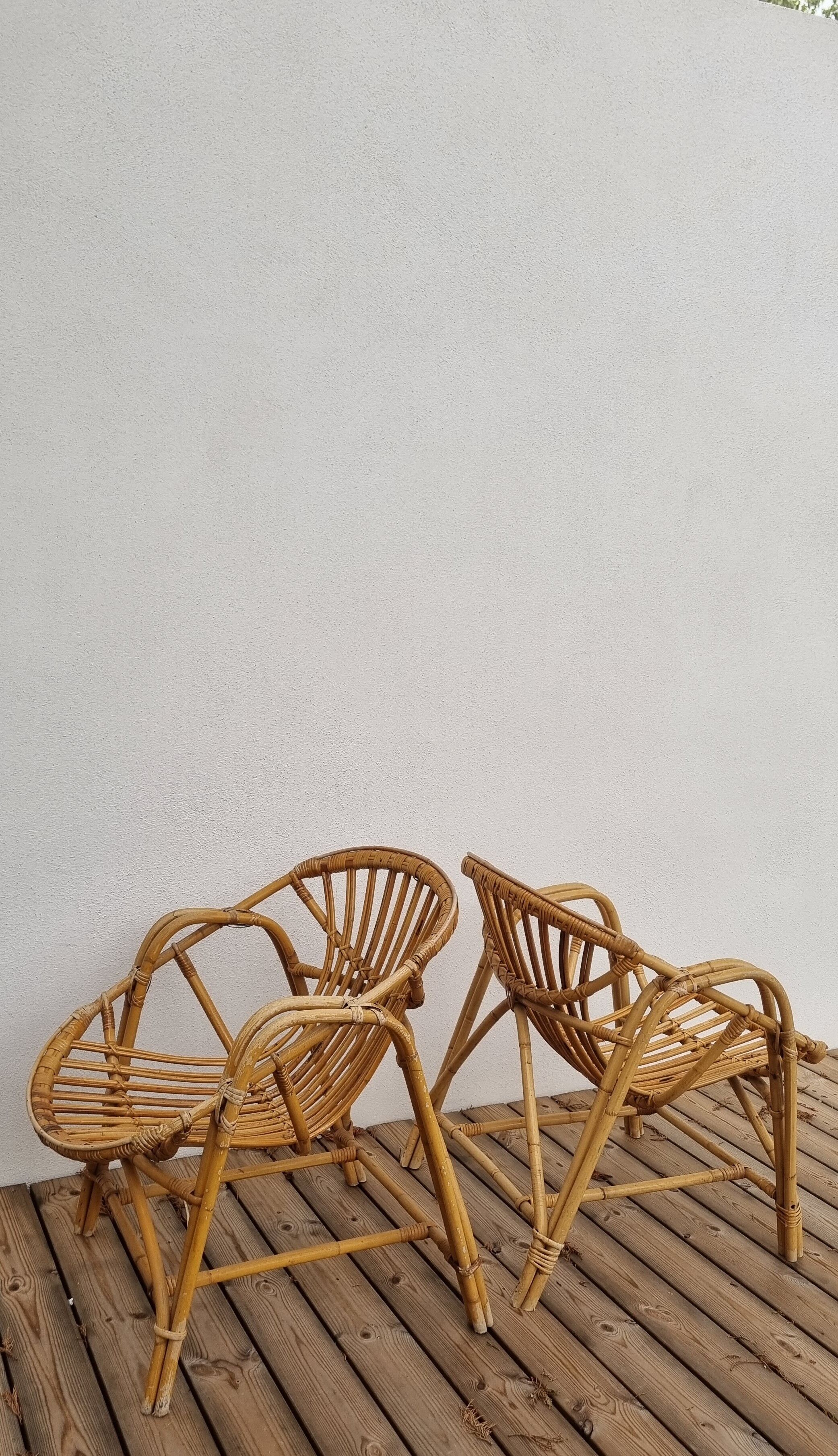 pair of Coquille rattan armchairs