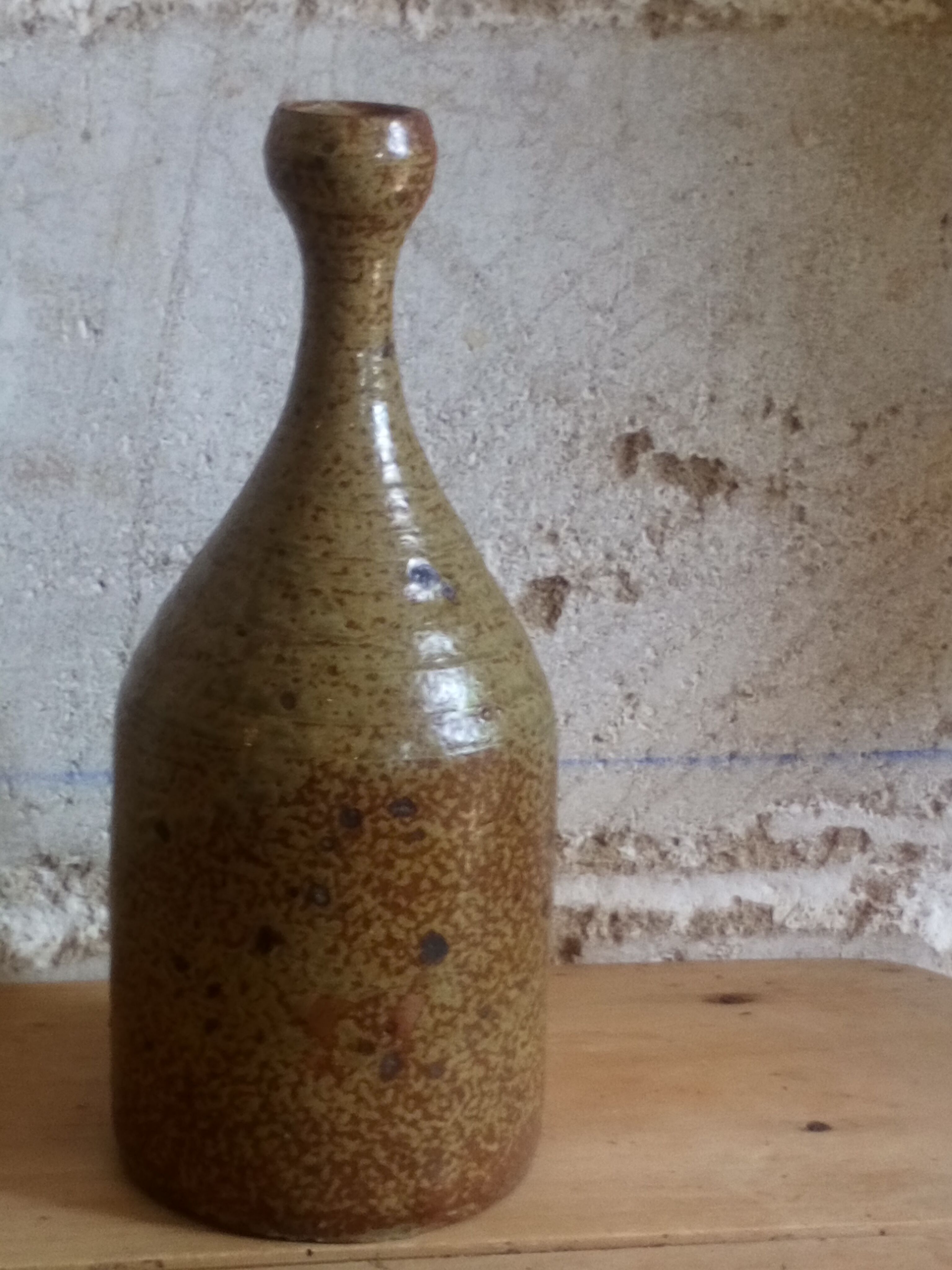 Bottled sandstone vase with a narrow neck