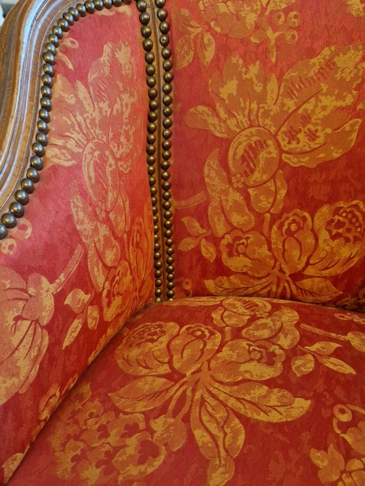 Pair of louis xv cabriolet armchairs with sculpted wood and pink & red floral fabric