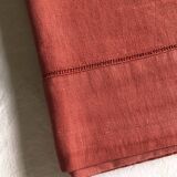 Old linen and cotton sheet in brick red