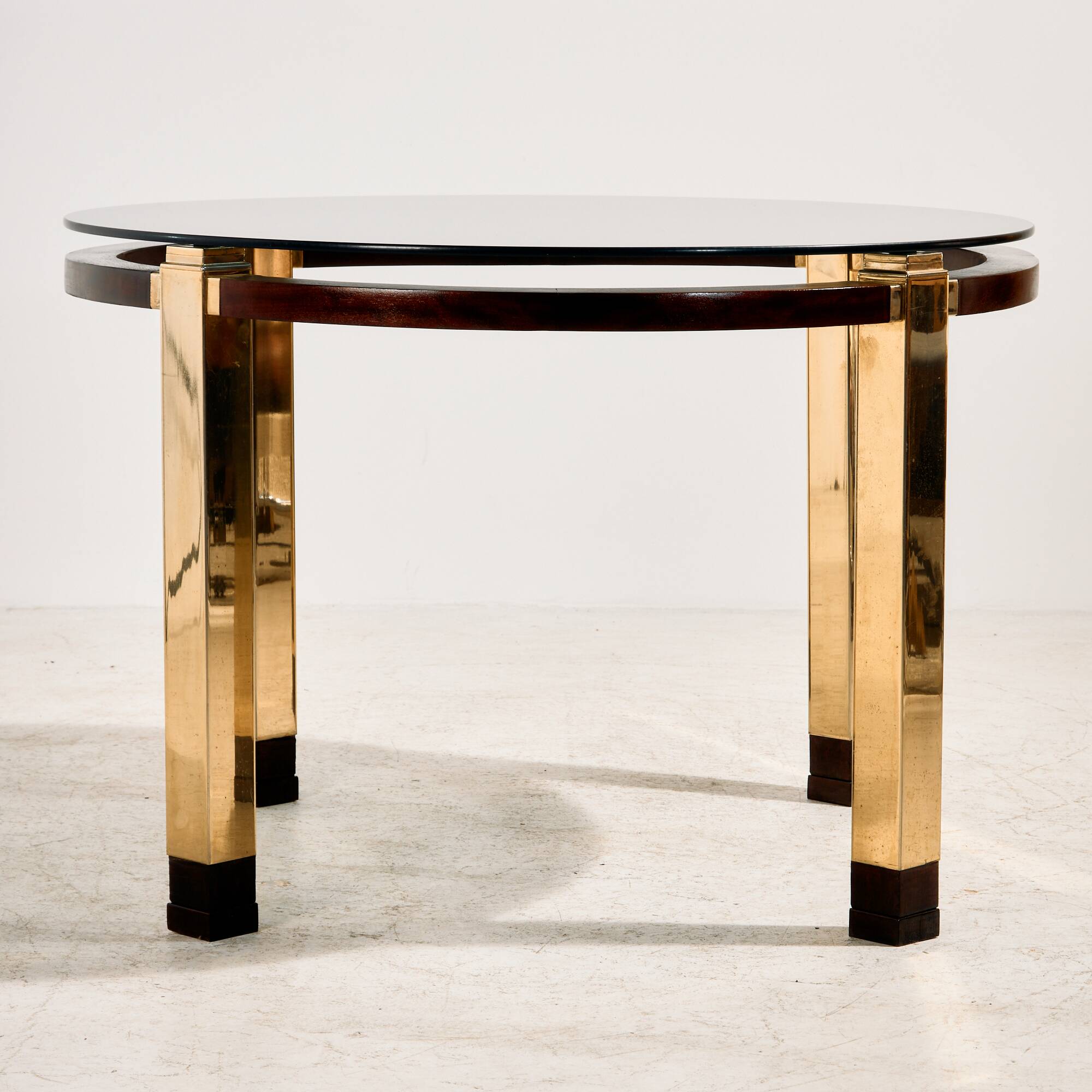 Restored dining table in mahogany and brass.