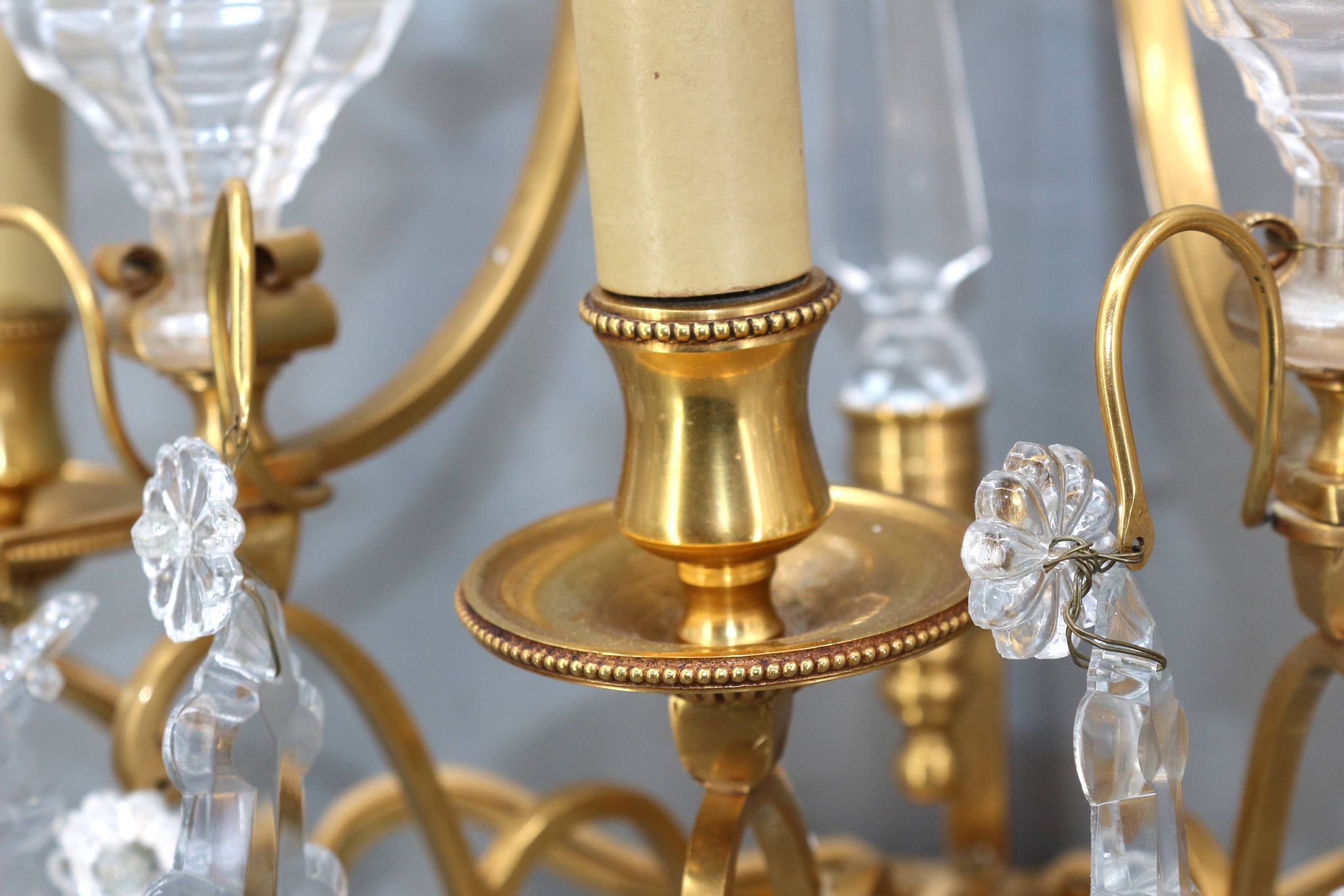 Pair of Louis XVI style gilded bronze & bohemian crystal sconces
