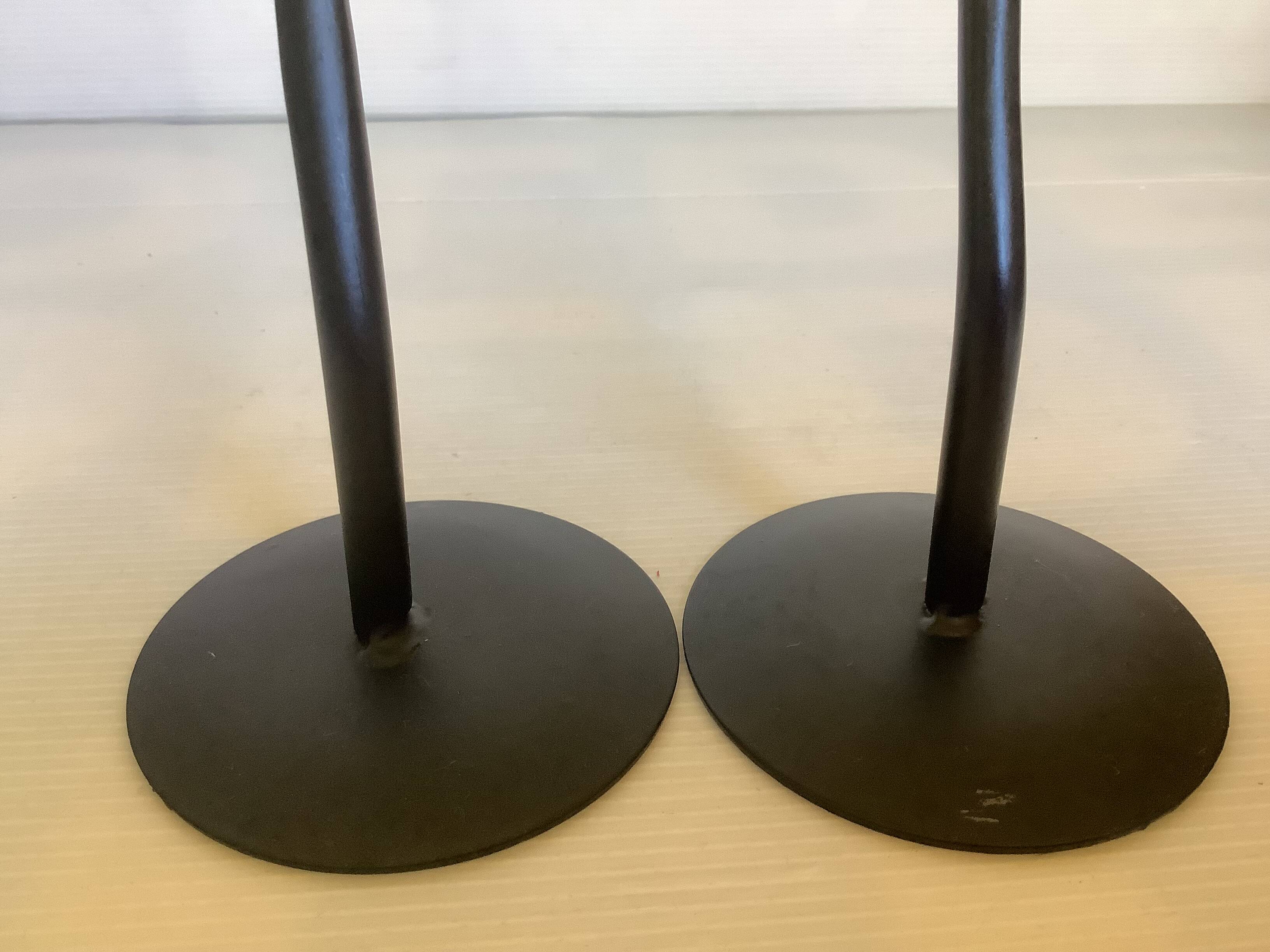 Pair of black hysteria-style candlesticks