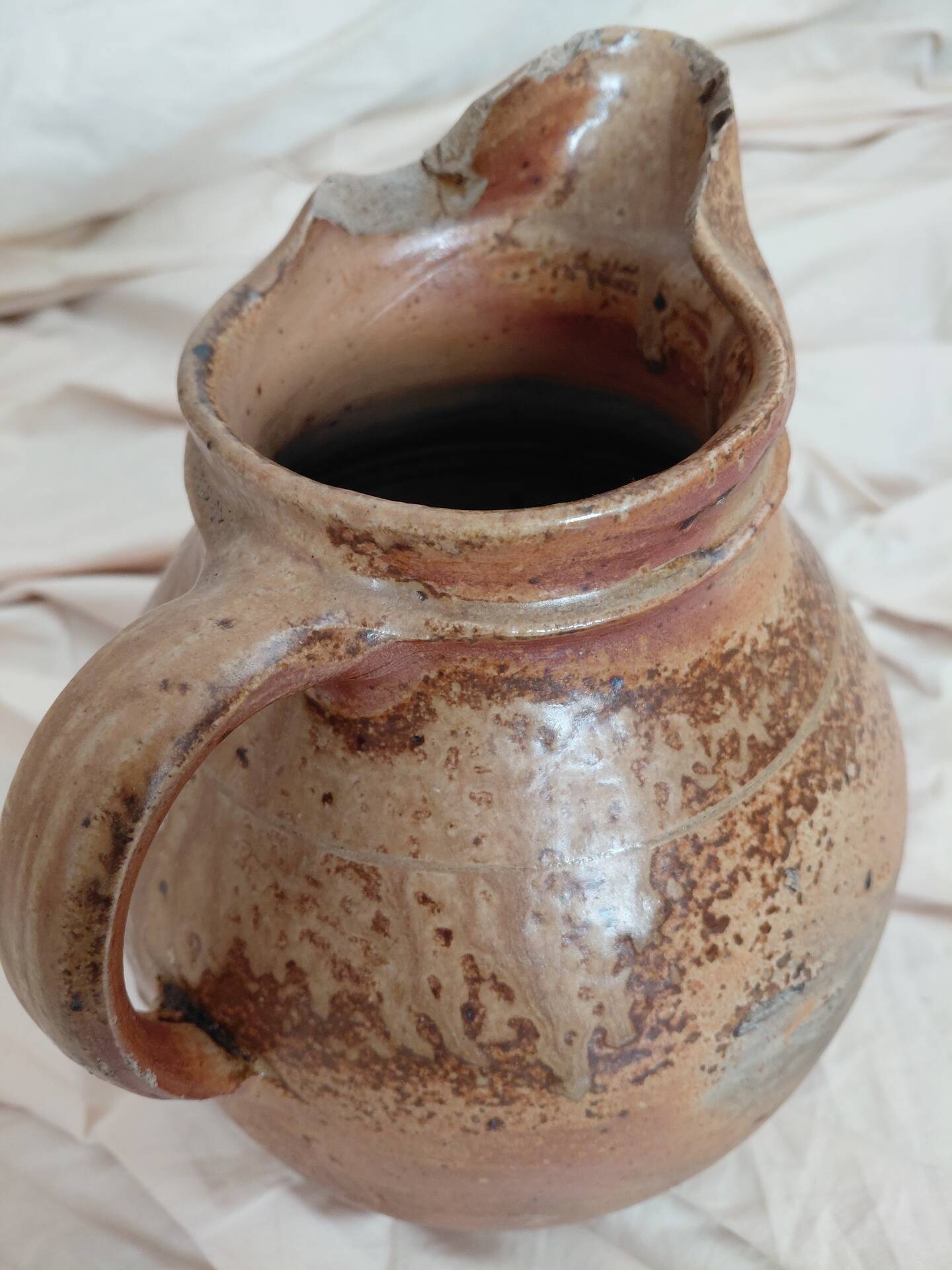 Old farm jug in glazed stoneware