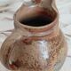 Old farm jug in glazed stoneware