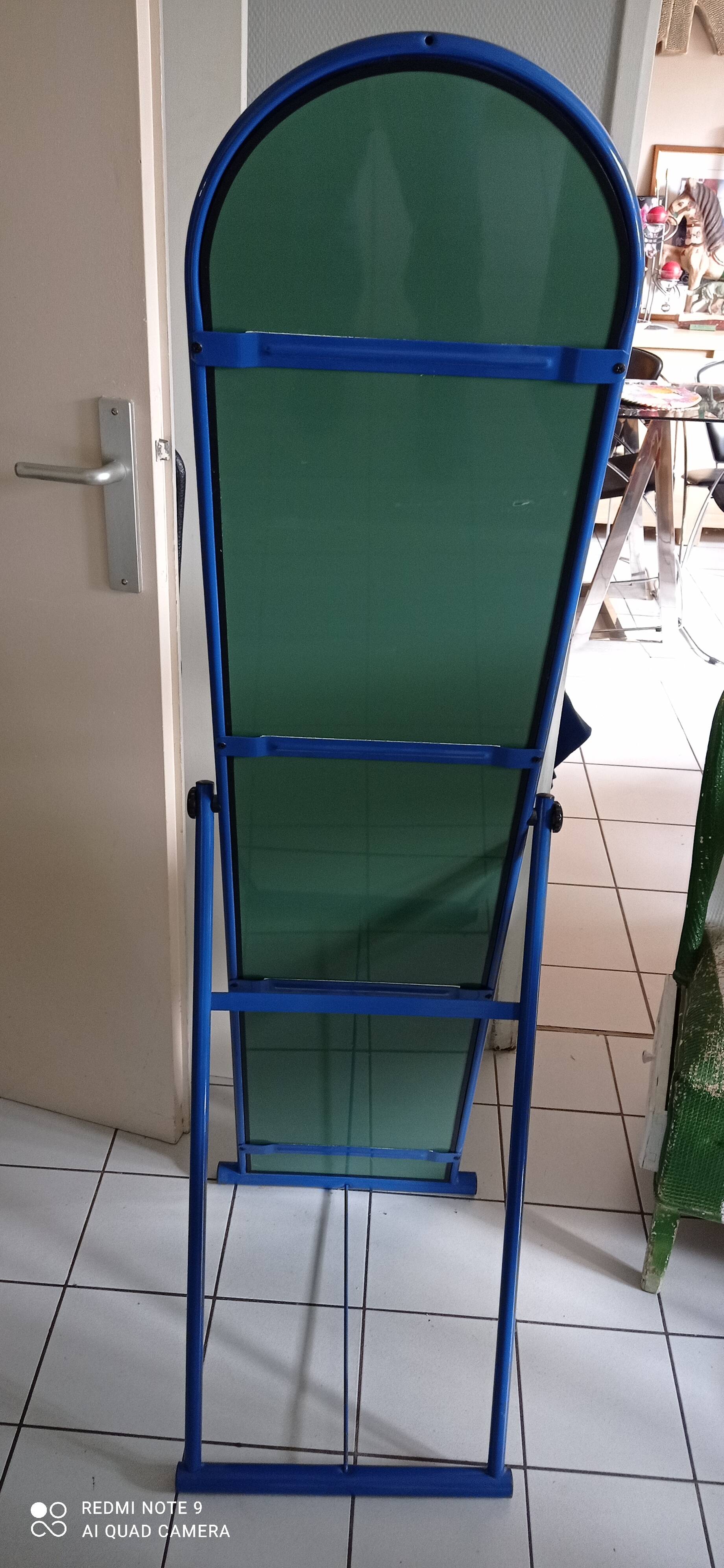 Adjustable mirror on vintage blue tubular structure stand