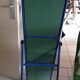 Adjustable mirror on vintage blue tubular structure stand
