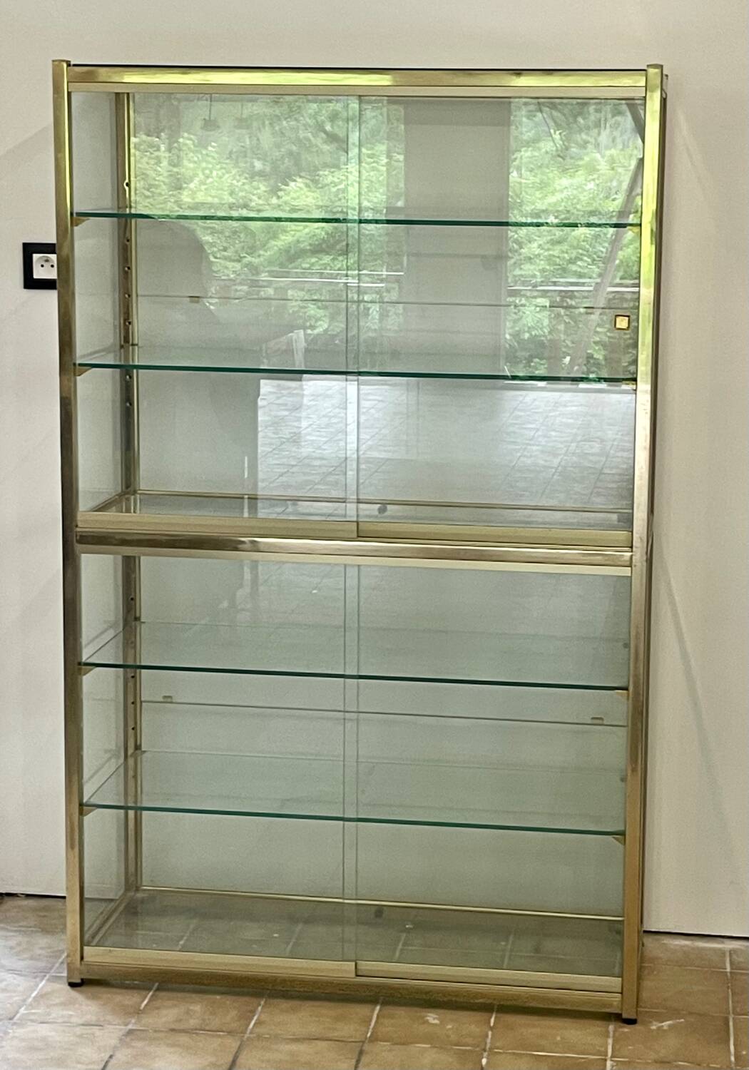 Large exhibition window in gilded brass 20th century period