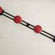 Wall-mounted coat rack in black and red metal (4 hooks)