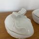 Pair of porcelain egg-shaped pocket trays