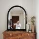 Large black lacquered mirror 1970