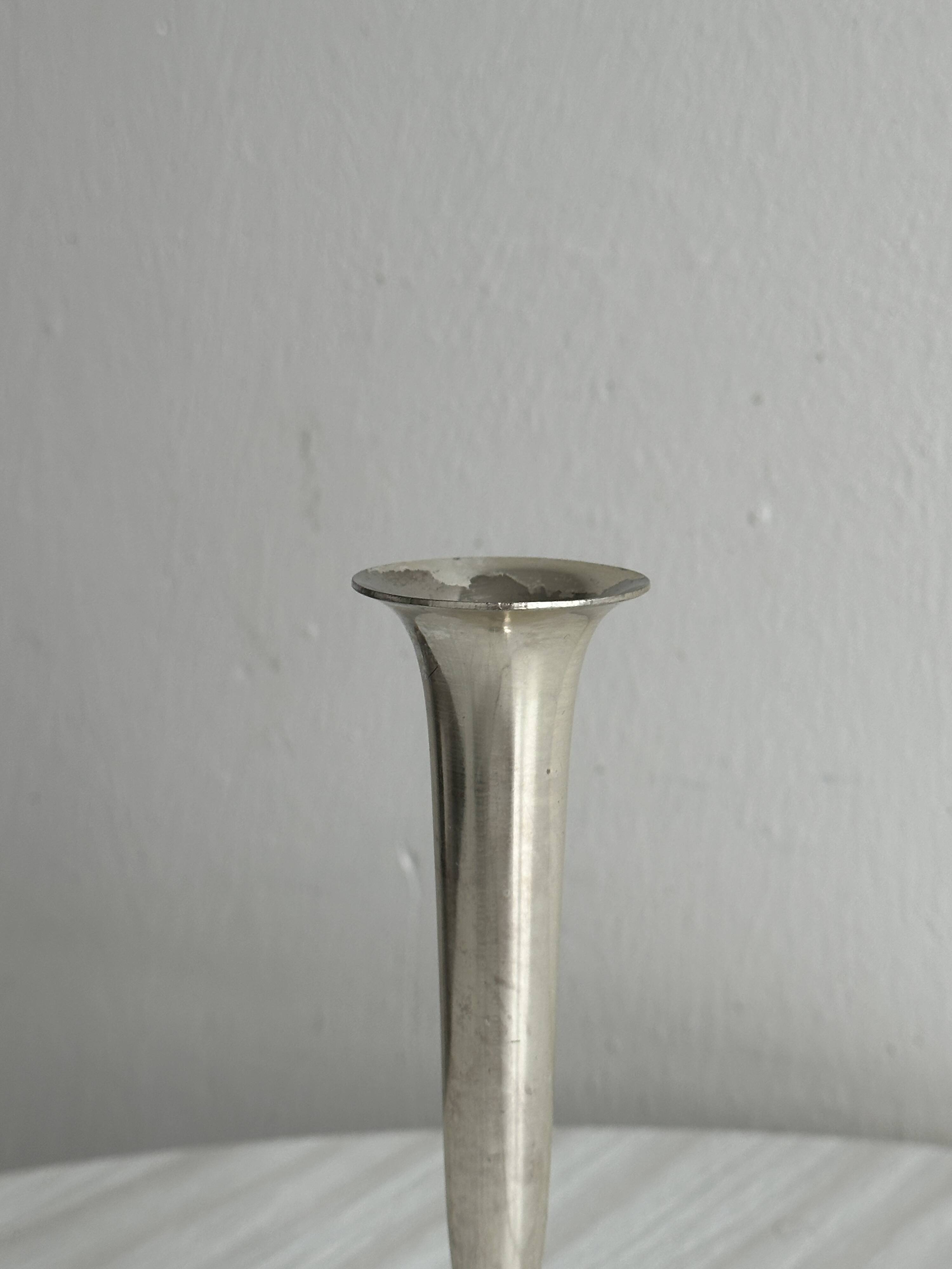 Small shiny metal bud vase
