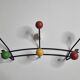 Vintage wall coat rack in black metal and wood, Roger Féraud style from the 1960s.