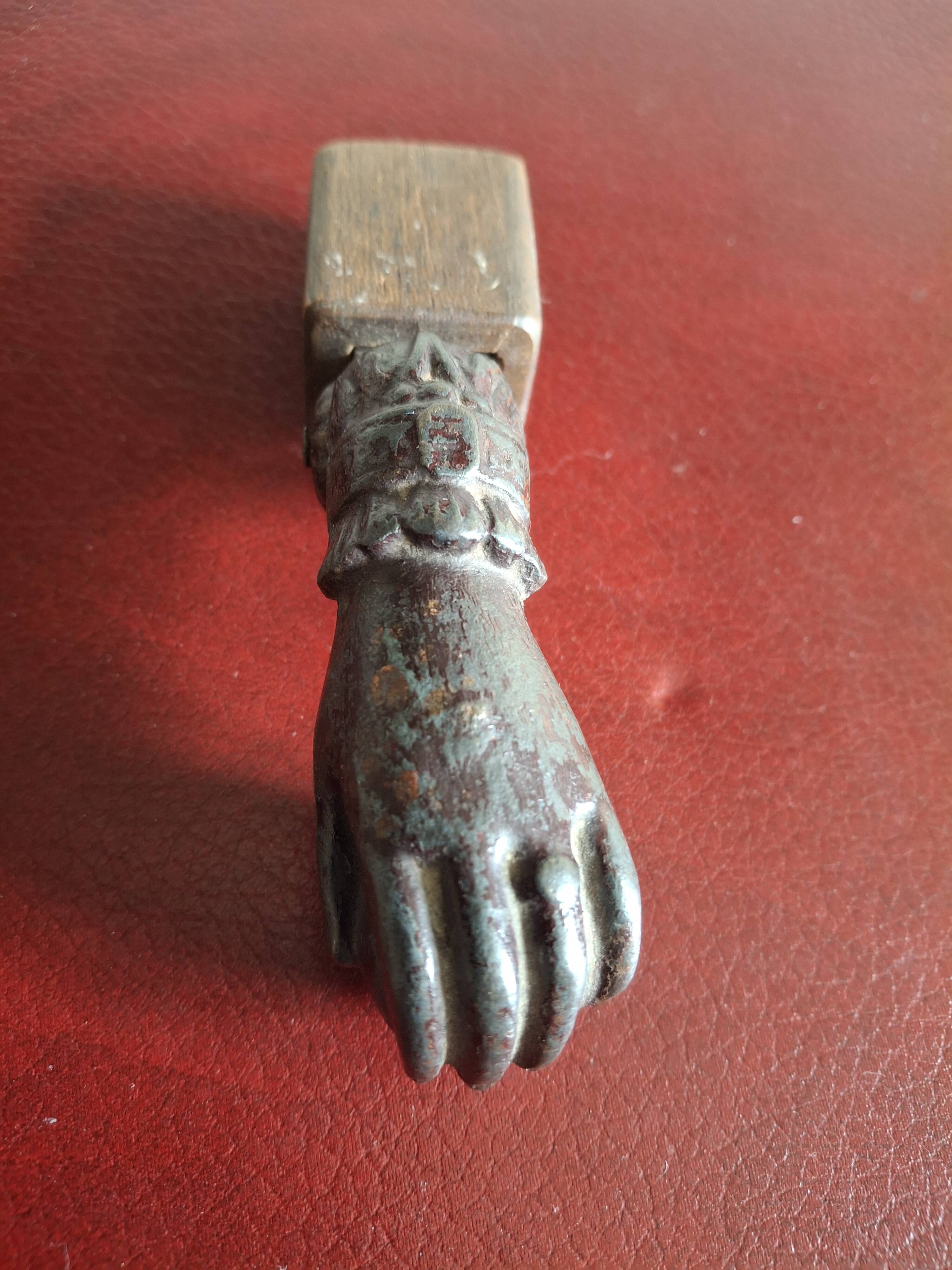 Cast iron door knocker from the 19th century or earlier.
