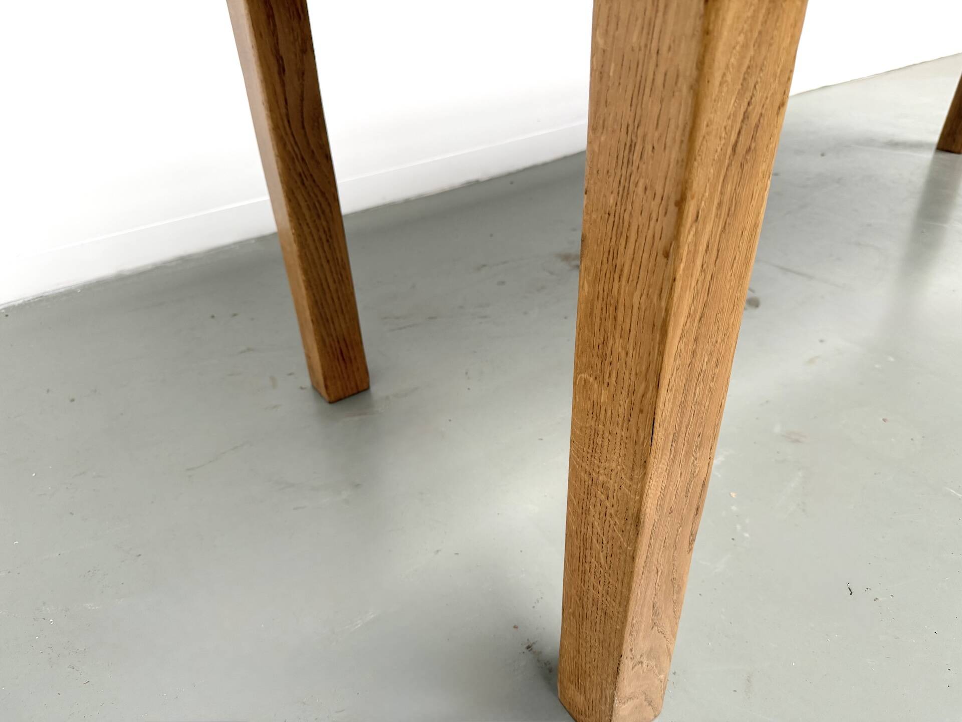 Solid oak farmhouse table, square legs.