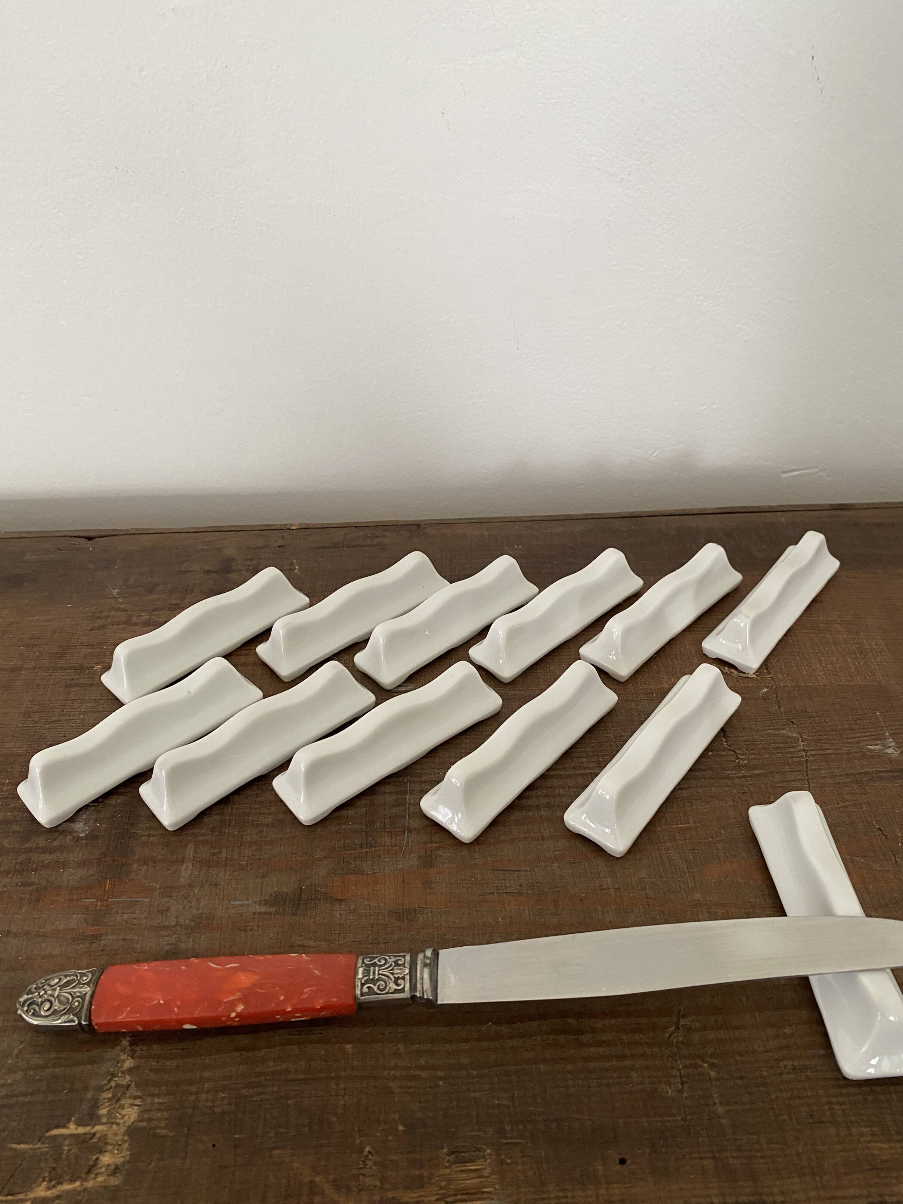 Vintage knife holders of 12, in white wave-shaped porcelain
