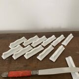 Vintage knife holders of 12, in white wave-shaped porcelain