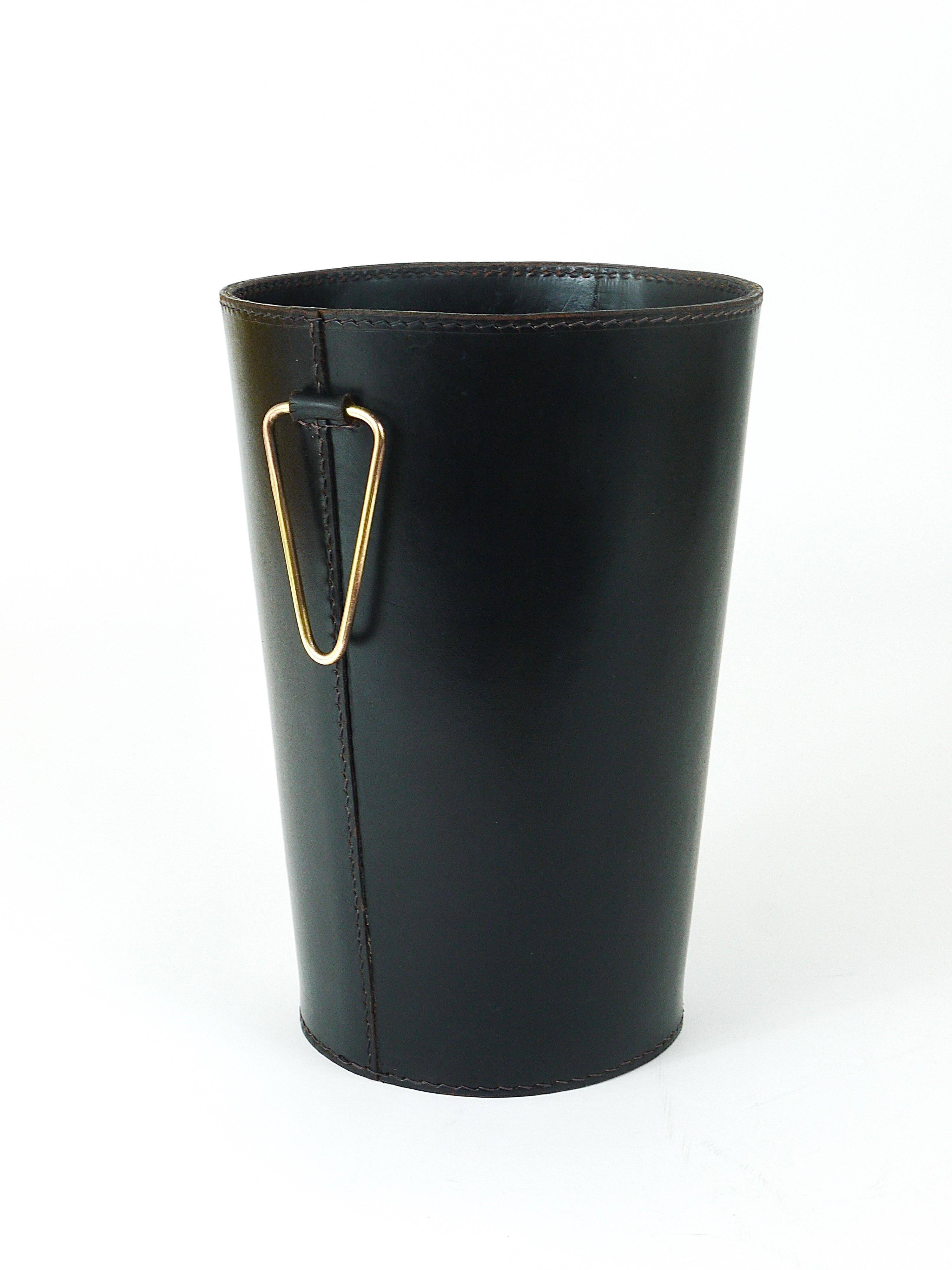 Mid-Century paper bin by Carl Auböck in black leather and brass, Austria, 1950s.
