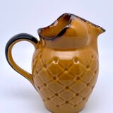 Yellow and brown ceramic pitcher
