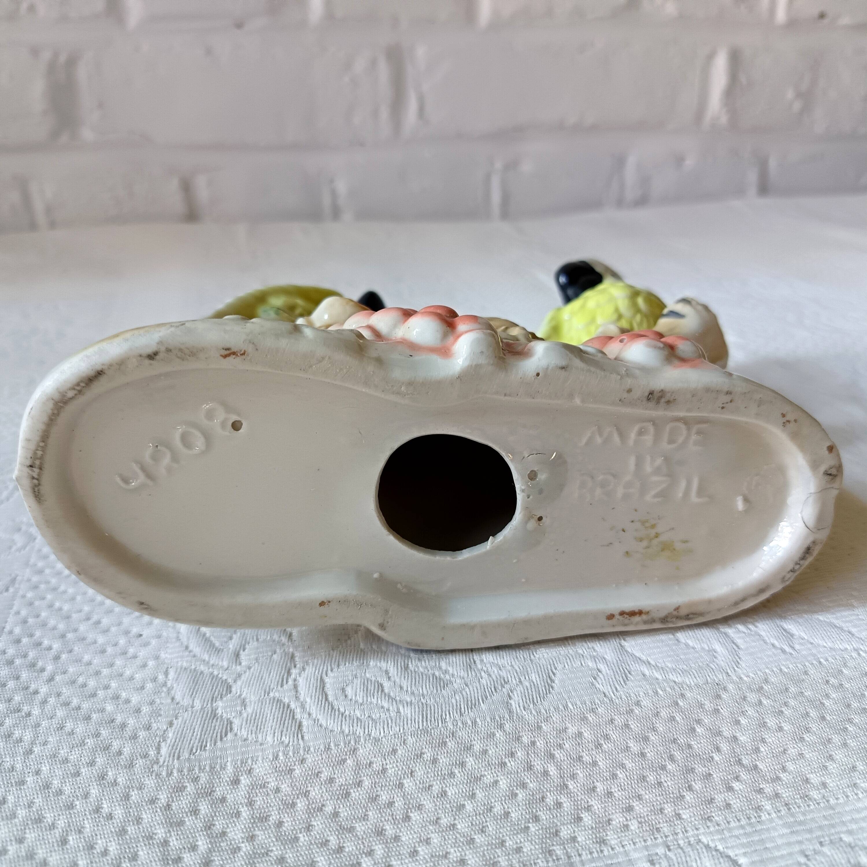 Vintage kitsch iridescent porcelain bird statuette