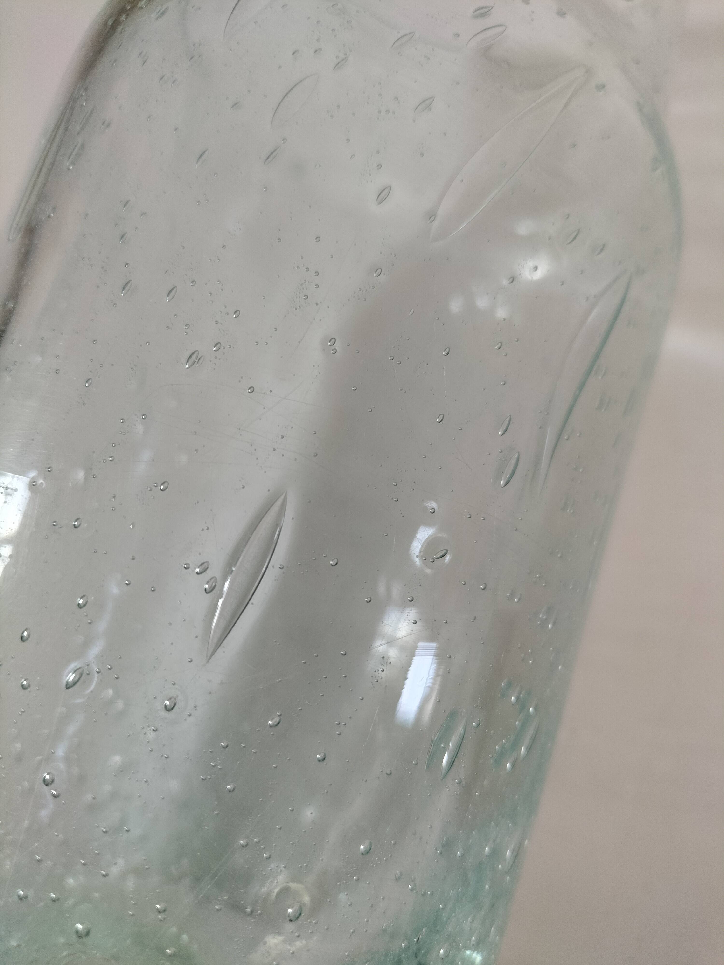 Vintage vase in very pale green bubbled glass, handcrafted