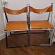 2 Chromed metal and leather folding chairs. 70s. Fontoni & Geraci