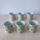 Porcelain coffee cups, green flower patterns