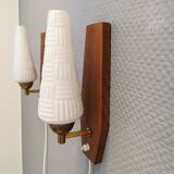 Danish wall lights from the 1970s, made of milky white glass shades, teak wood suspension and brass.
