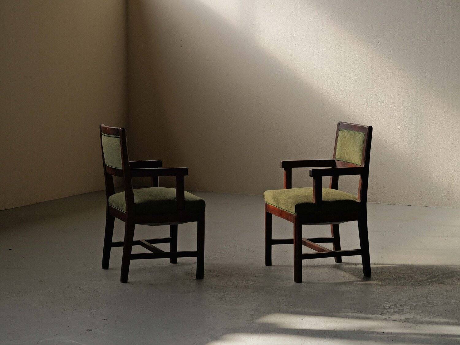 Pair of modernist armchairs in solid oak, France, circa 1940.