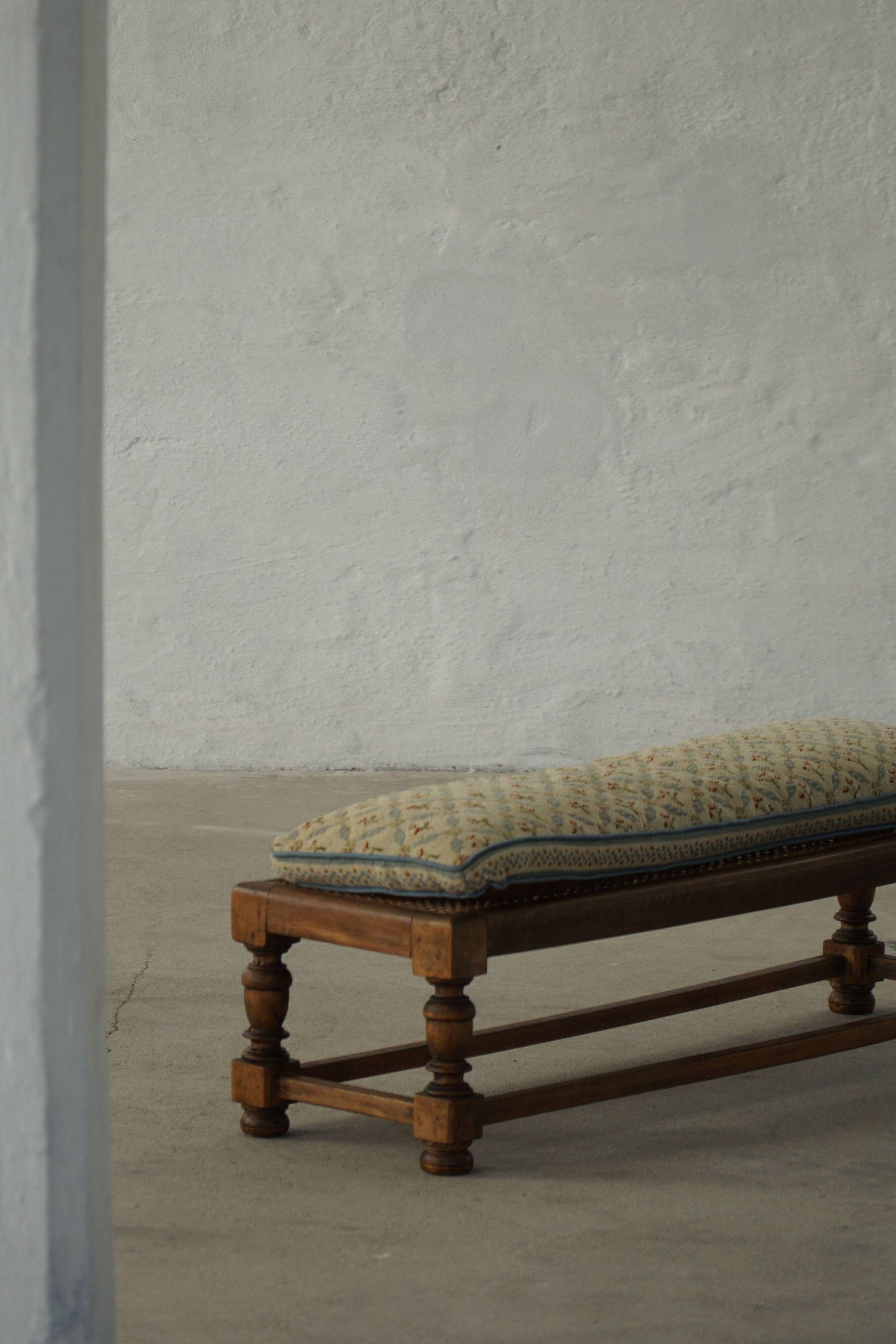 Danish oak footrest with hand-embroidered cushion and rattan seat, baroque, 1940s.