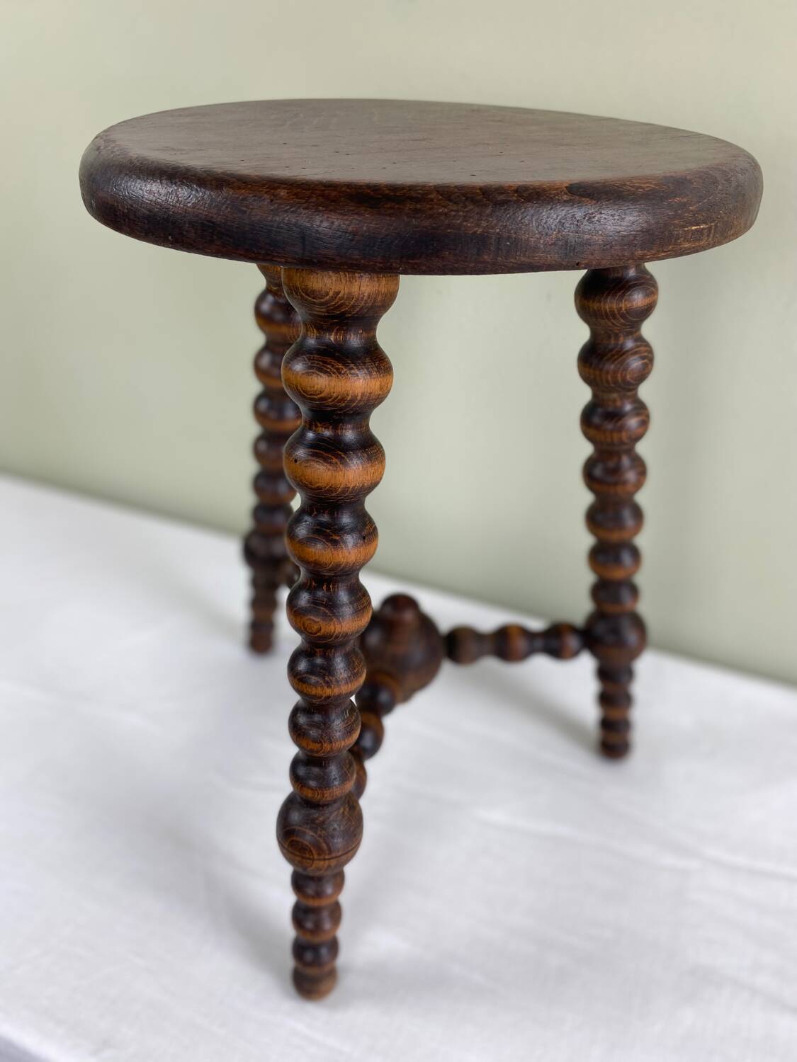 Signed turned wood tripod stool