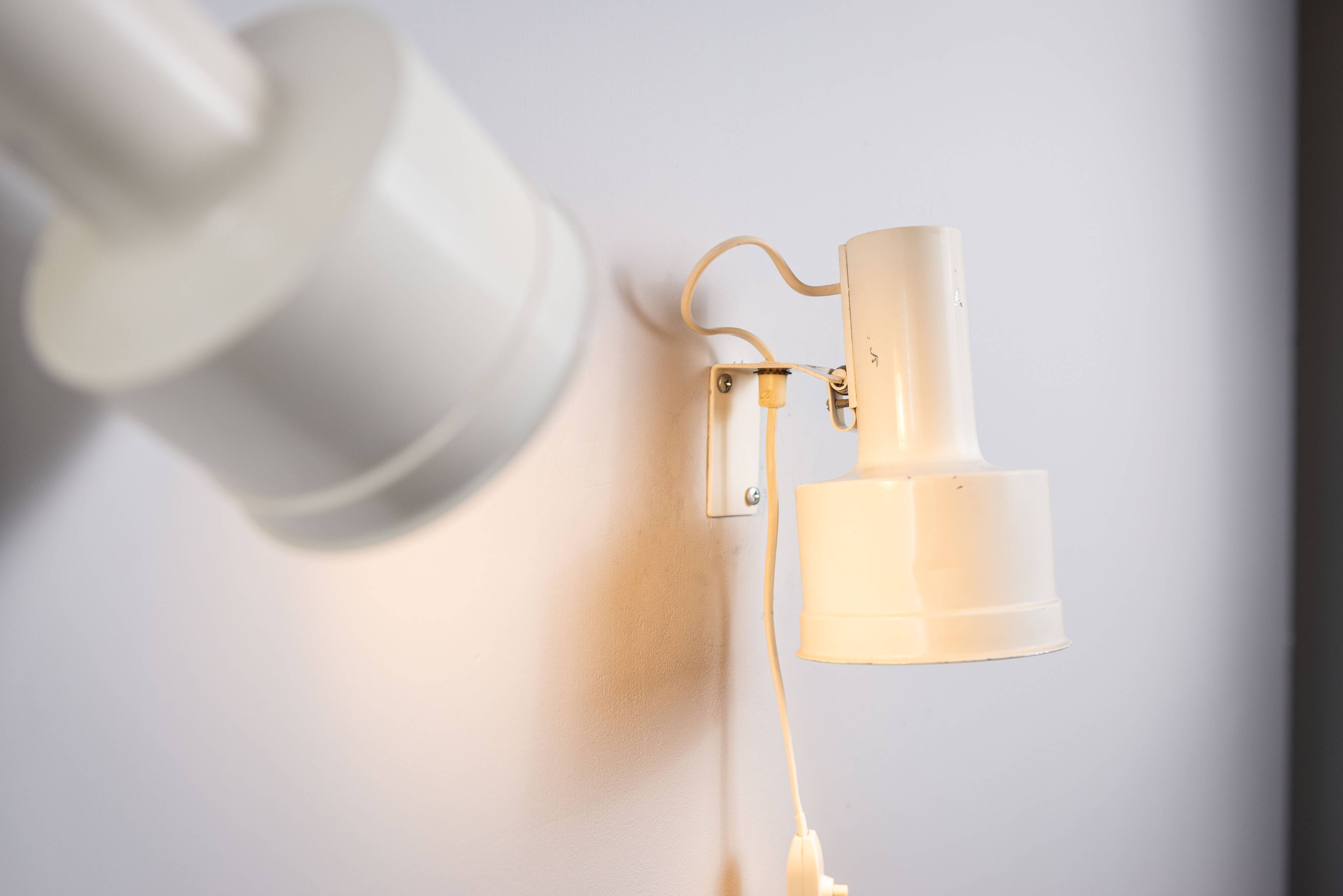 Pair of adjustable wall lamps designed by Per Sundstedt for Kosta Lampan