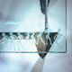 2 brutalist steel side tables with primitive  scene motifs etched glass