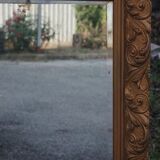Wooden mirror decorated with gold from the 1920s
