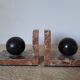 Pair of red marble bookends with black stone spheres – Art Style