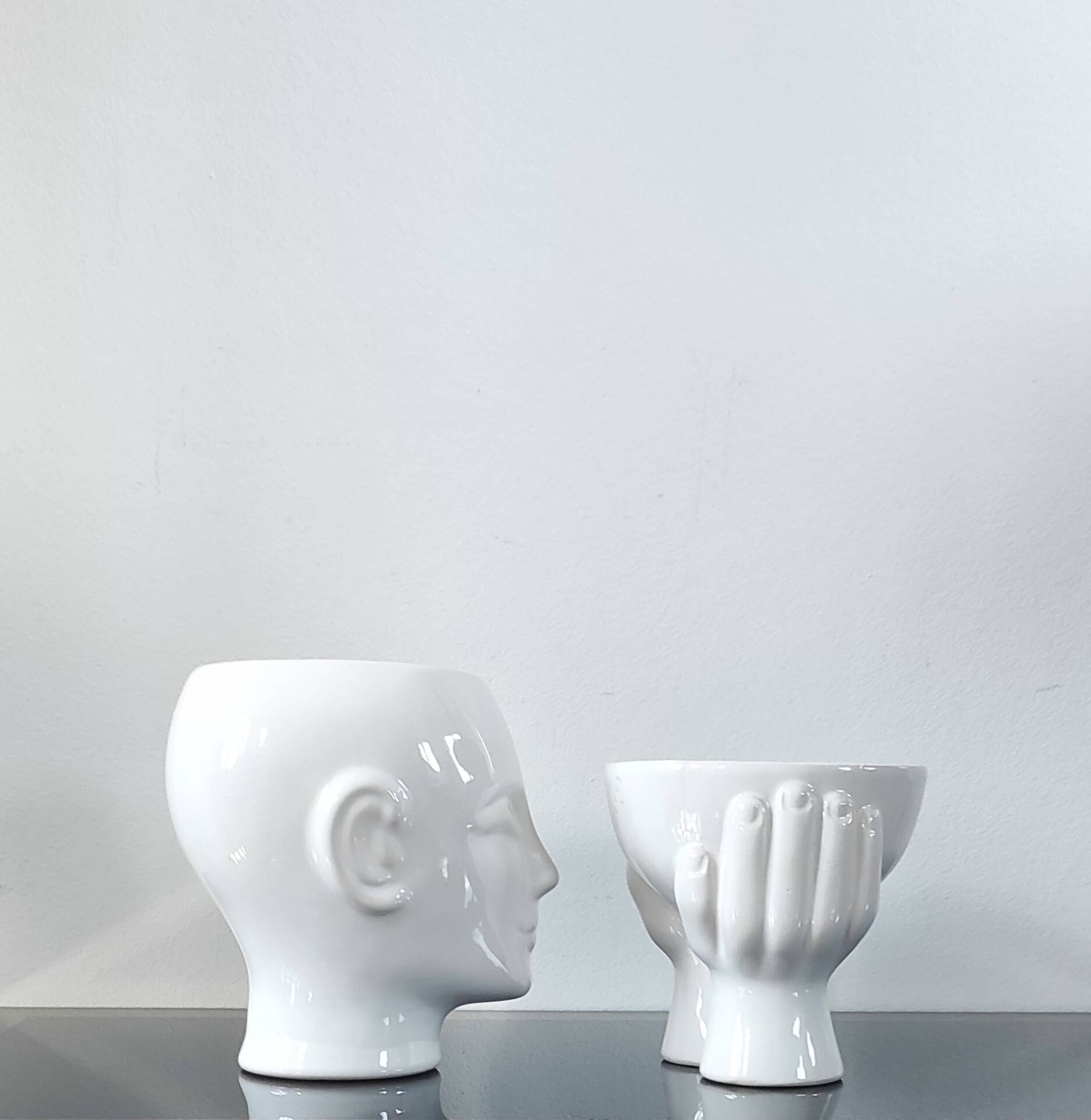 A pair of vintage ceramic plant pots.