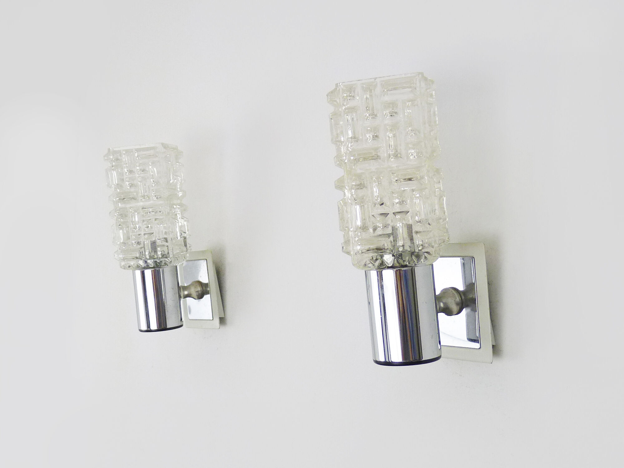 Pair of space age wall sconces, stainless steel and thick glass, 60s 70s