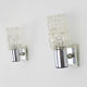 Pair of space age wall sconces, stainless steel and thick glass, 60s 70s